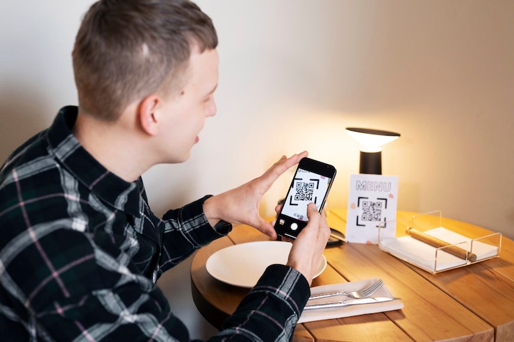 Free Photo medium shot smiley man scanning qr
