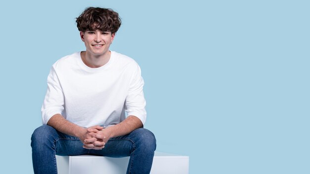 Medium shot smiley man sitting on chair