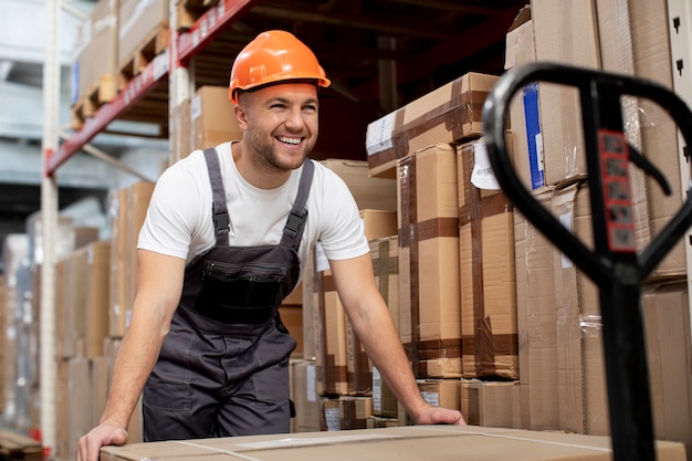 Medium shot smiley man in warehouse