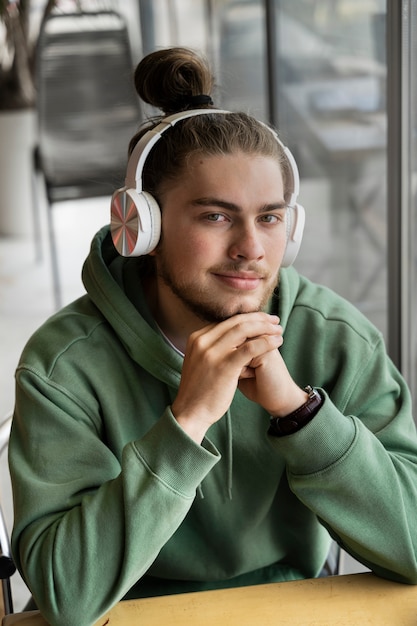 Medium shot smiley man wearing headphones