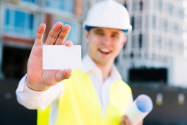 Medium shot smiley man with business card