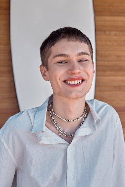 Medium shot smiley man with chain necklace outdoors