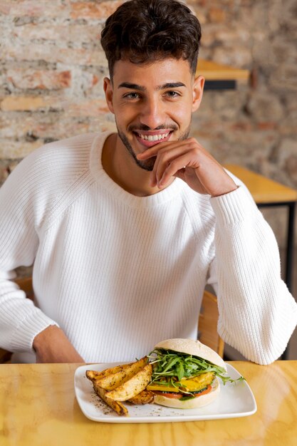 Medium shot smiley man with food