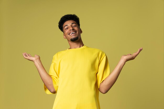 Medium shot smiley man with yellow background