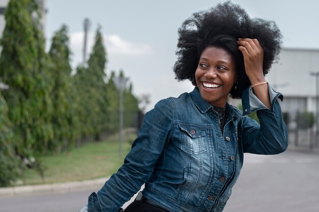 Medium shot smiley nigerian woman