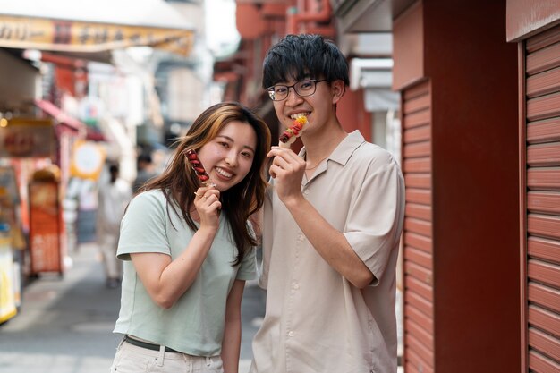 Medium shot smiley people at food festival