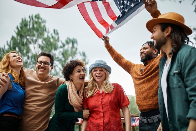 medium shot smiley people holding flag