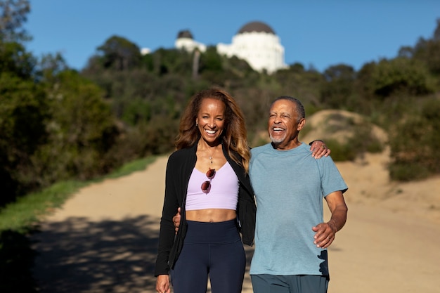 Medium shot smiley people in nature