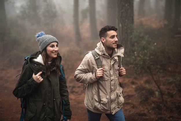 Medium shot smiley people walking