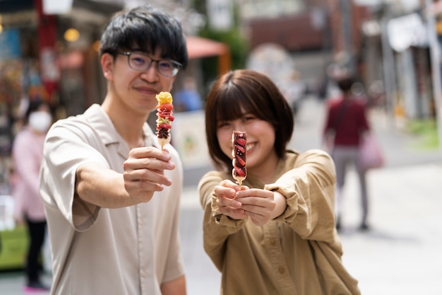 Medium shot smiley people with food