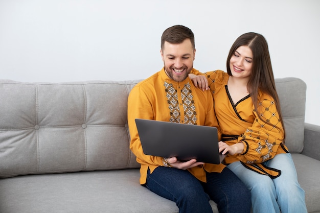 Medium shot smiley people with laptop