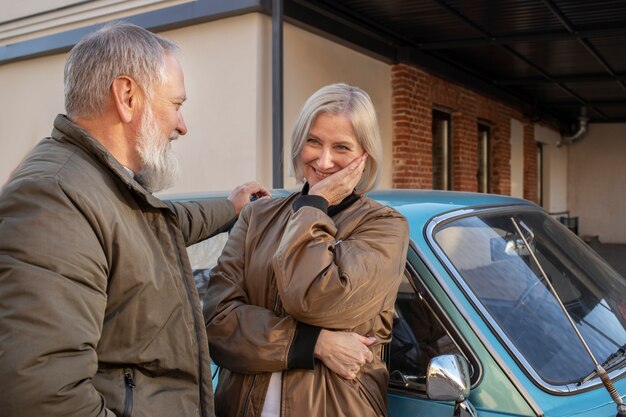 Free photo medium shot smiley senior couple outdoors