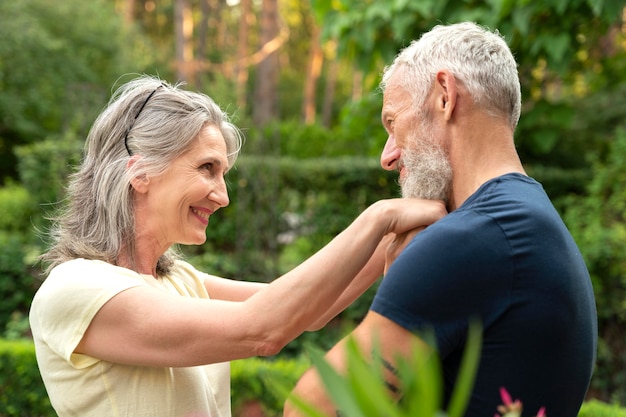 Medium shot smiley senior couple