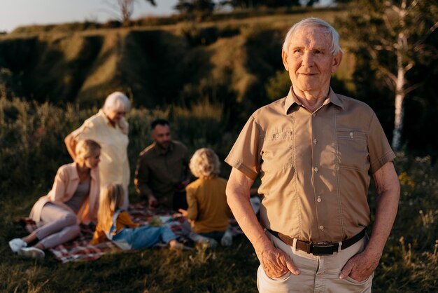 Medium shot smiley senior man outdoors