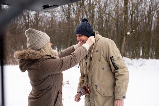 Medium shot smiley senior people in nature