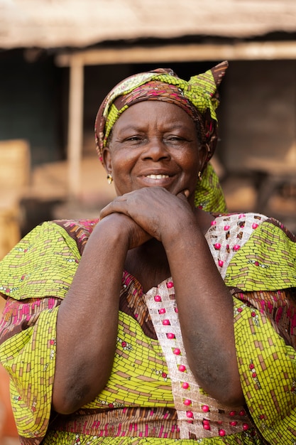 Medium shot smiley senior woman outside