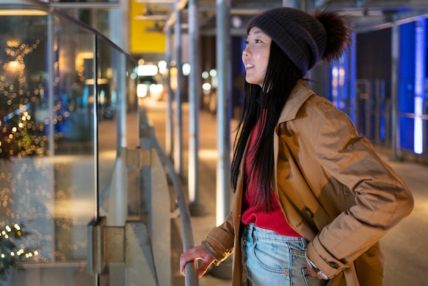 Medium shot smiley teenager wearing hat