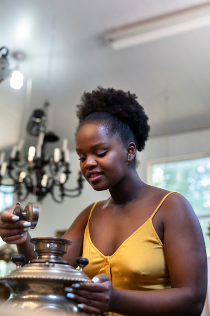 Medium shot smiley woman at the antique store