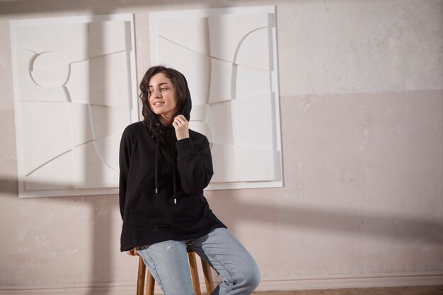 Medium shot smiley woman on chair