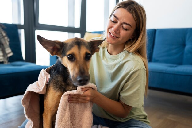 Medium shot smiley woman and cute dog