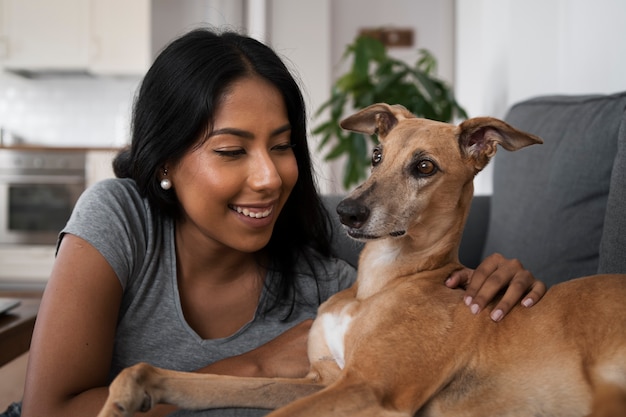 medium shot smiley woman and dog