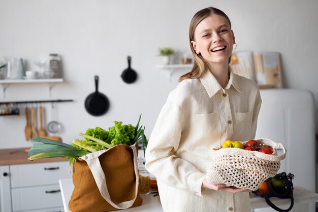medium shot smiley woman holding bag