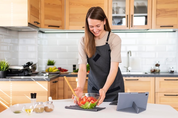 Medium shot smiley woman holding bowl