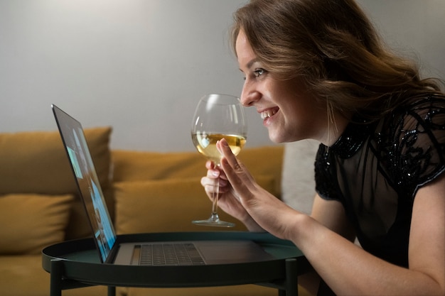 Medium shot smiley woman holding glass