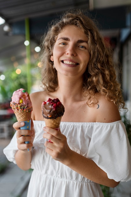 Medium Shot Smiley Woman Holding Ice Cream