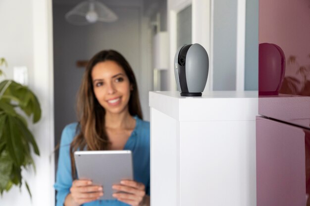 Medium shot smiley woman holding tablet