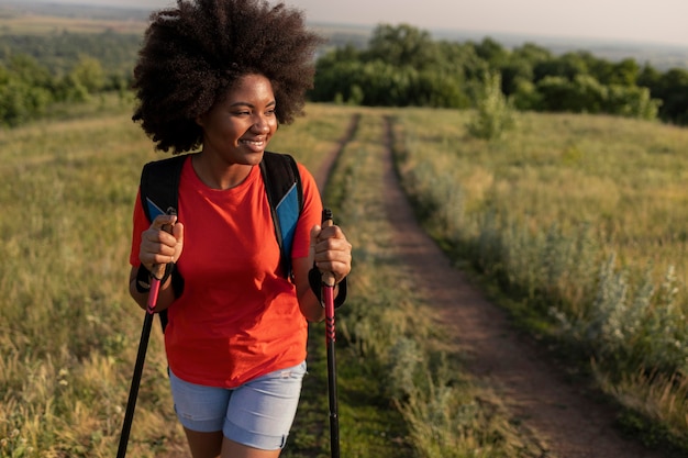 Medium shot smiley woman in nature