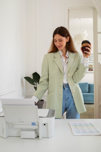 Medium shot smiley woman at office
