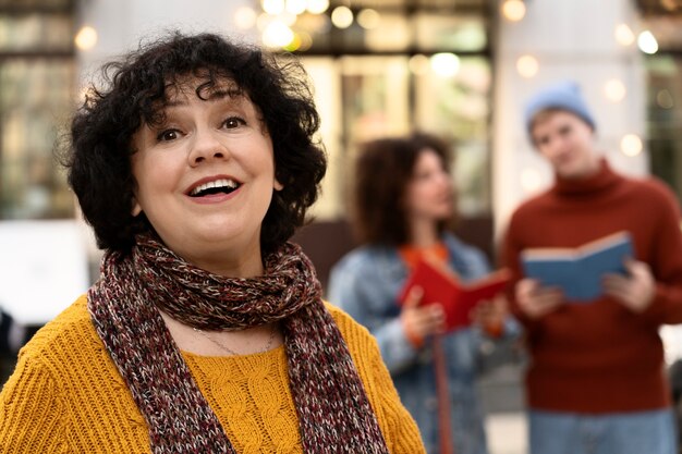 Medium shot smiley woman outdoors