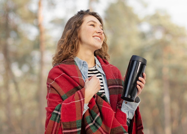 Free photo medium shot smiley woman outside