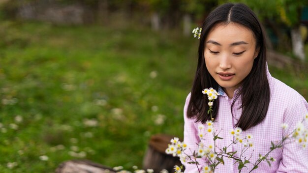 medium shot smiley woman sitting outdoors