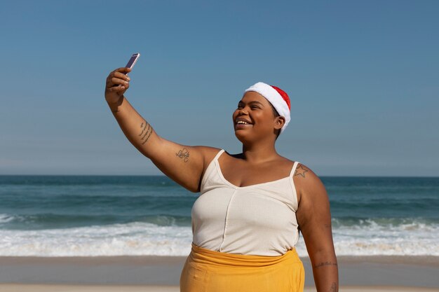 Medium shot smiley woman taking selfie