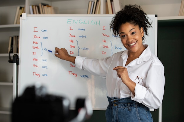 Medium shot smiley woman teaching