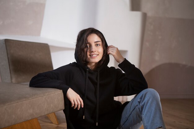 Medium shot smiley woman wearing black hoodie