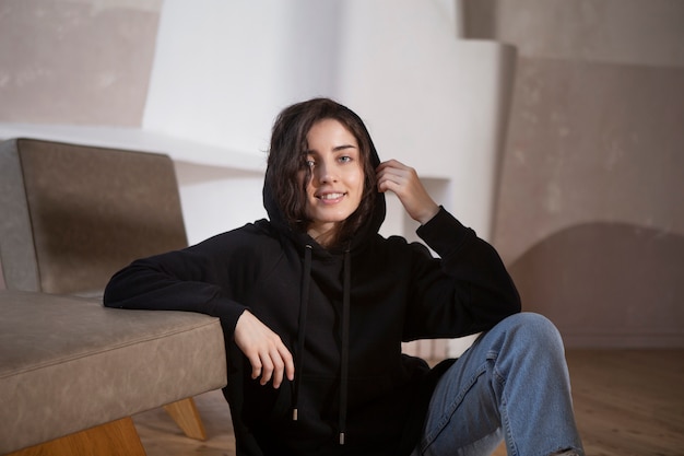 Medium shot smiley woman wearing black hoodie
