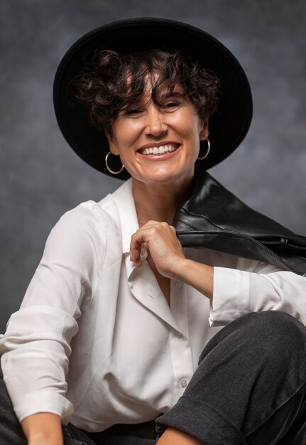 Medium shot smiley woman wearing hat