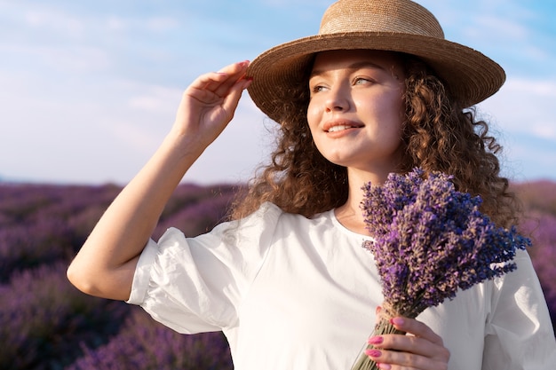 Medium shot smiley woman wearing hat