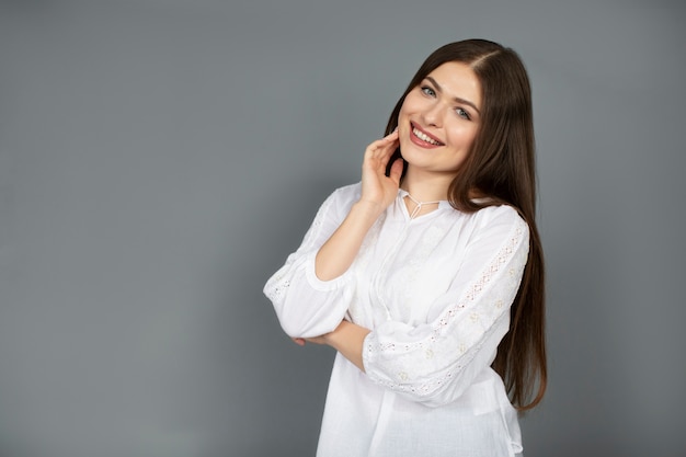 Medium shot smiley woman wearing ukranian shirt