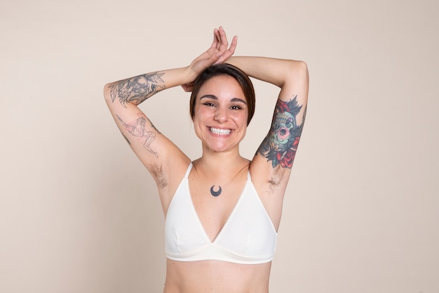 Medium shot smiley woman with armpit hair