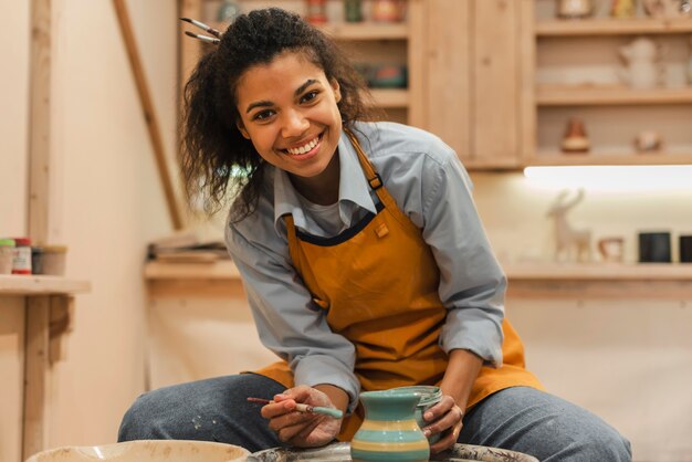 Medium shot smiley woman with brush