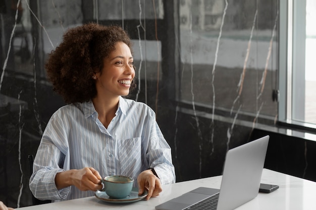 Medium shot smiley woman with coffee cup