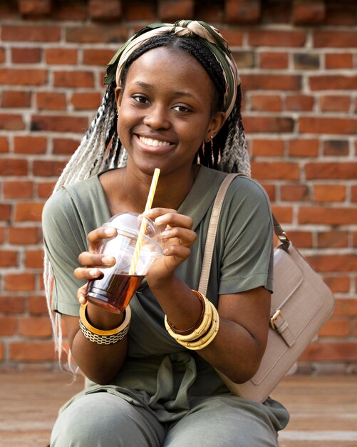 Medium shot smiley woman with cup