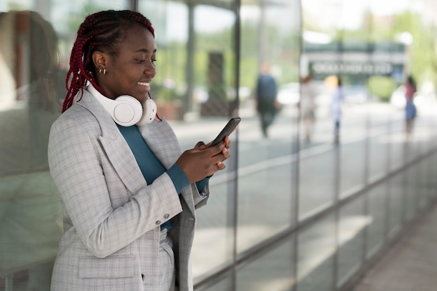 Medium shot smiley woman with devices