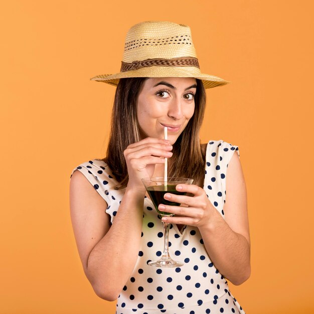 Medium shot smiley woman with drink