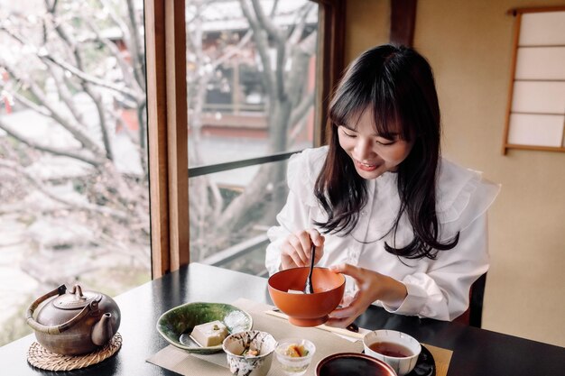 Medium shot smiley woman with food