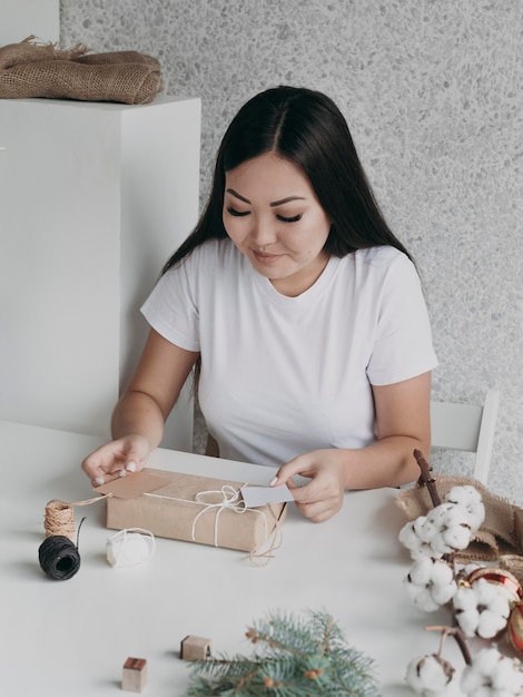 Medium shot smiley woman with gift